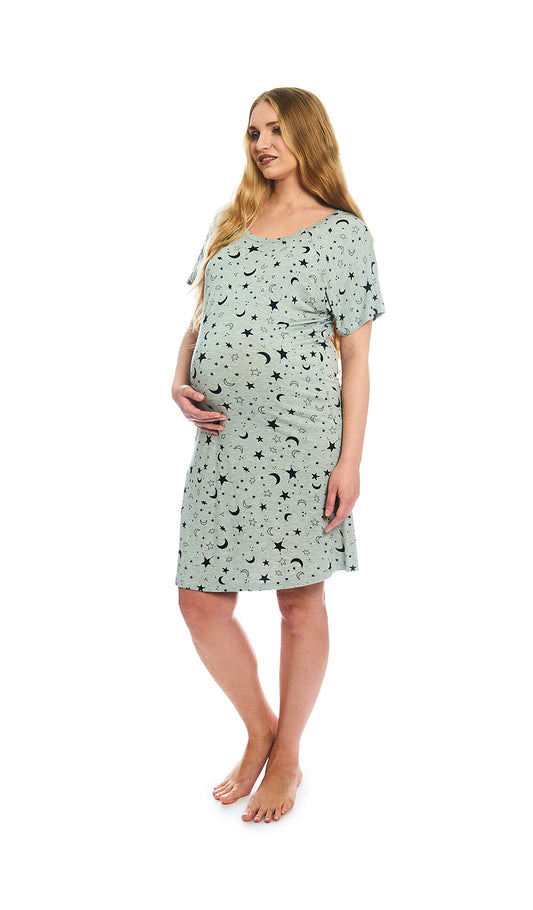 Twinkle Night Rosa hospital gown. Pregnant woman with one hand on belly, wearing hospital gown with scoop-neckline featuring dual snap openings.