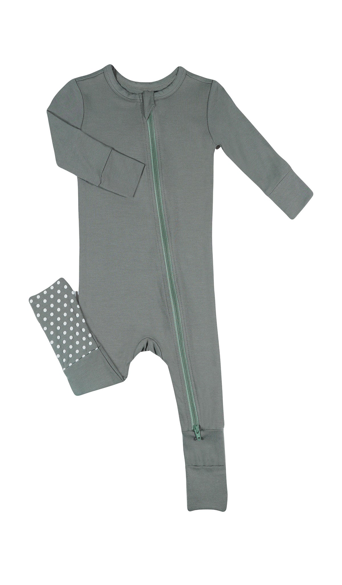 Basil Convertible Romper with long sleeves and zip front, one leg folded back to show the grippy sole on the footie.