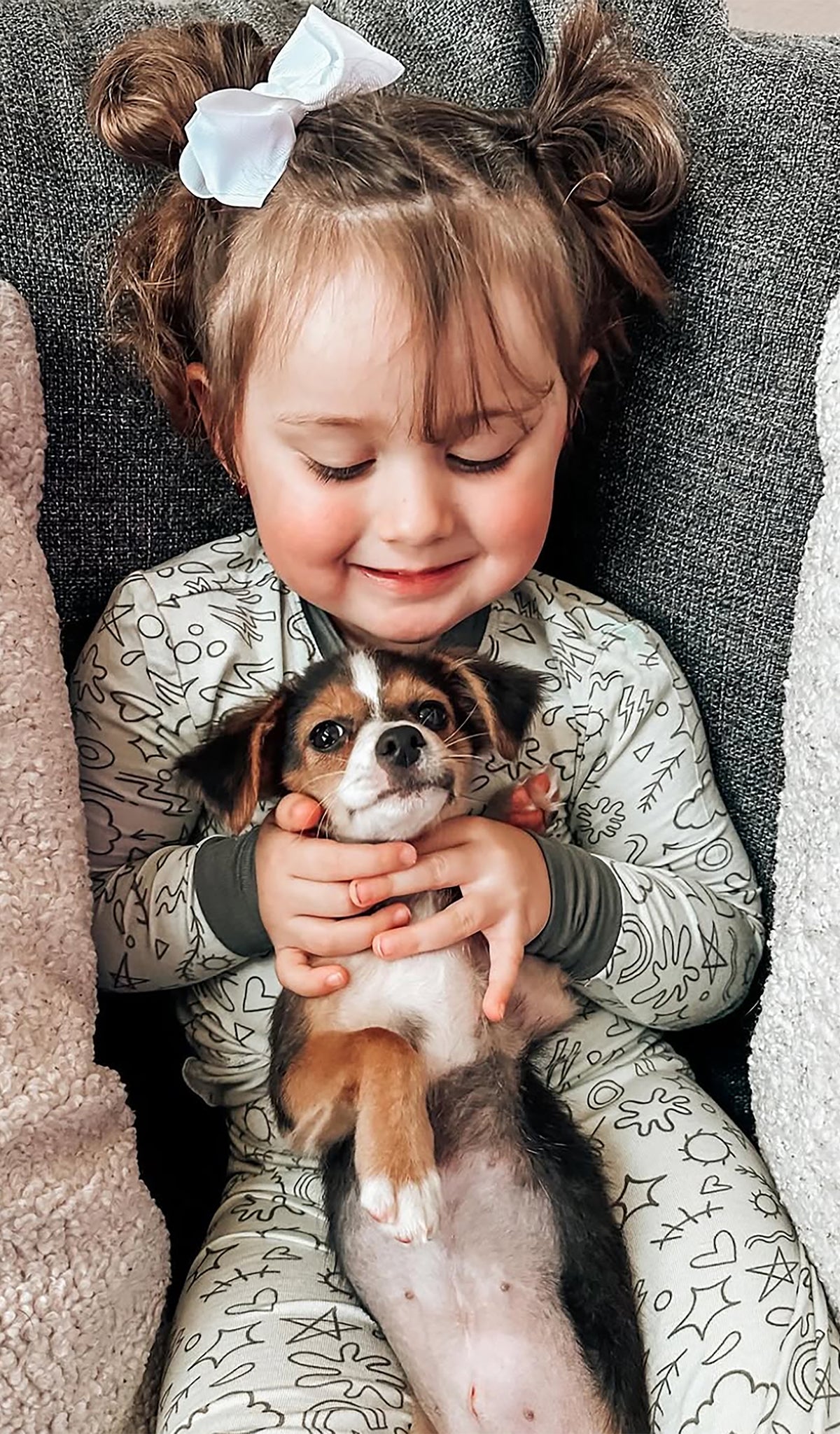 Sage Doodle Emerson 2-Piece Pant PJ worn by little girl holding her puppy.