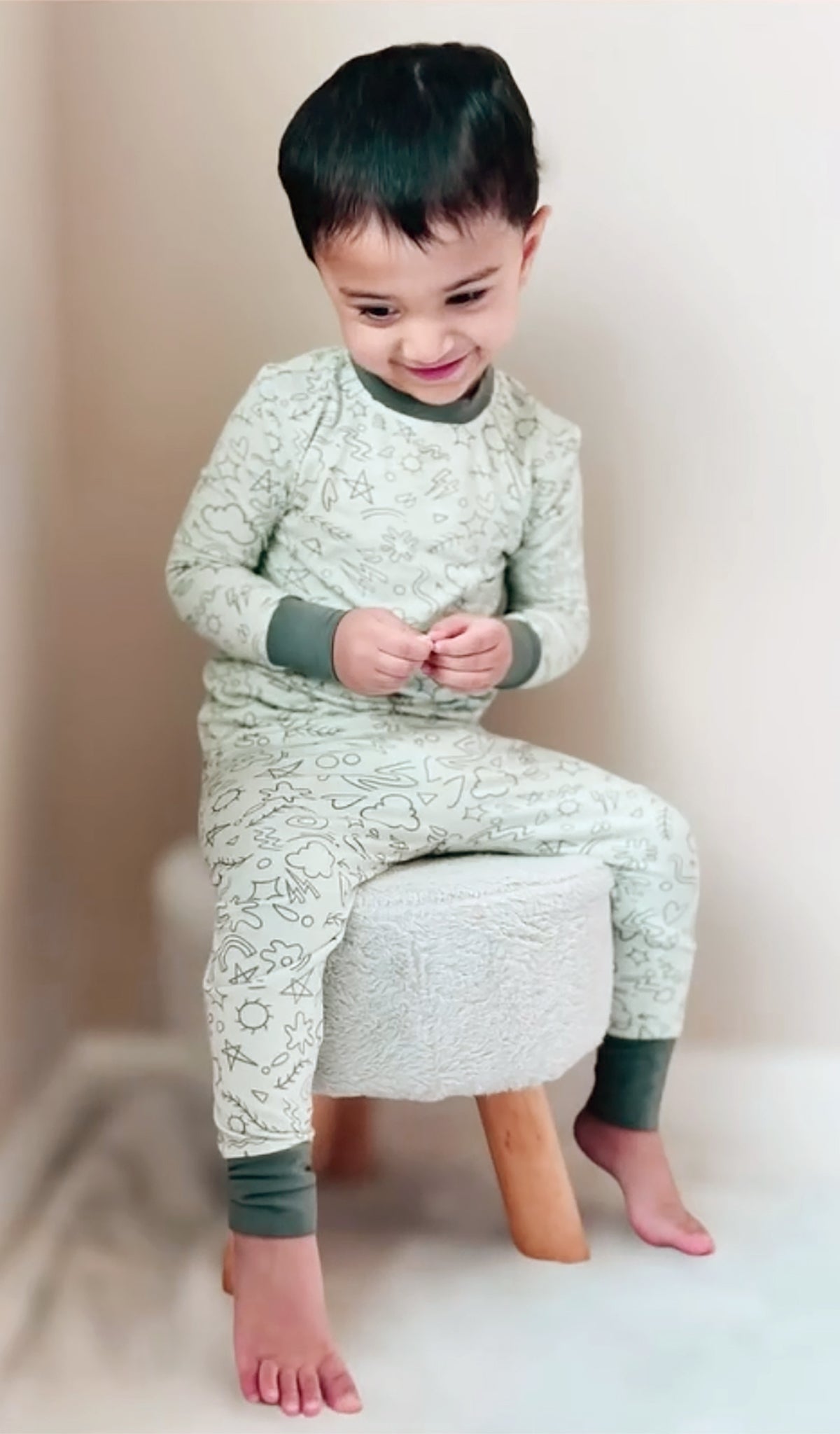 Sage Doodle Emerson 2-Piece Pant PJ worn by little boy sitting on a stool.