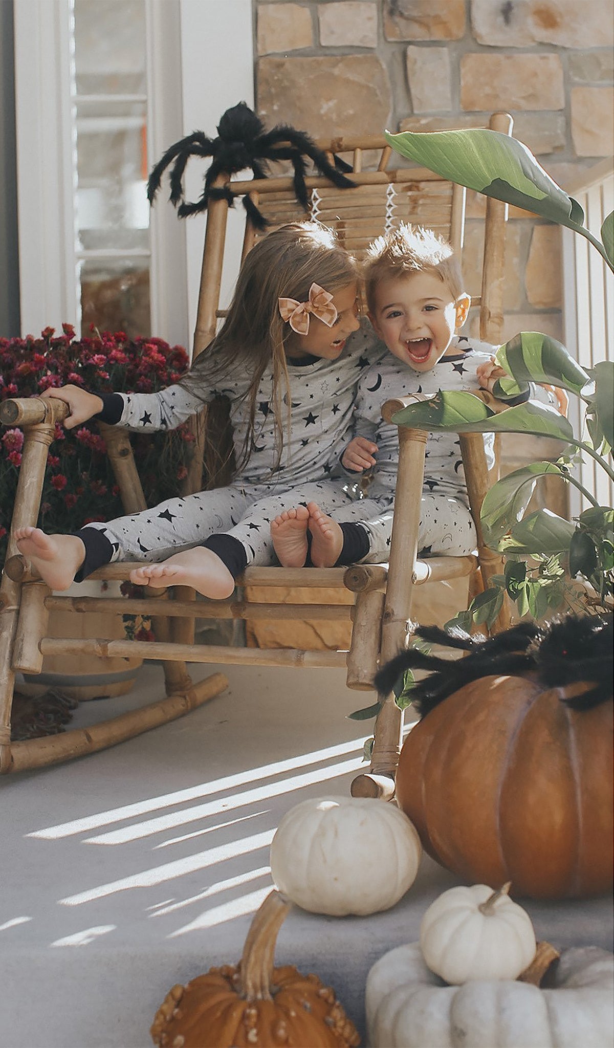Twinkle Night Emerson Baby 2-Piece Pant PJ worn by baby boy sitting next to his big sister in matching PJs.