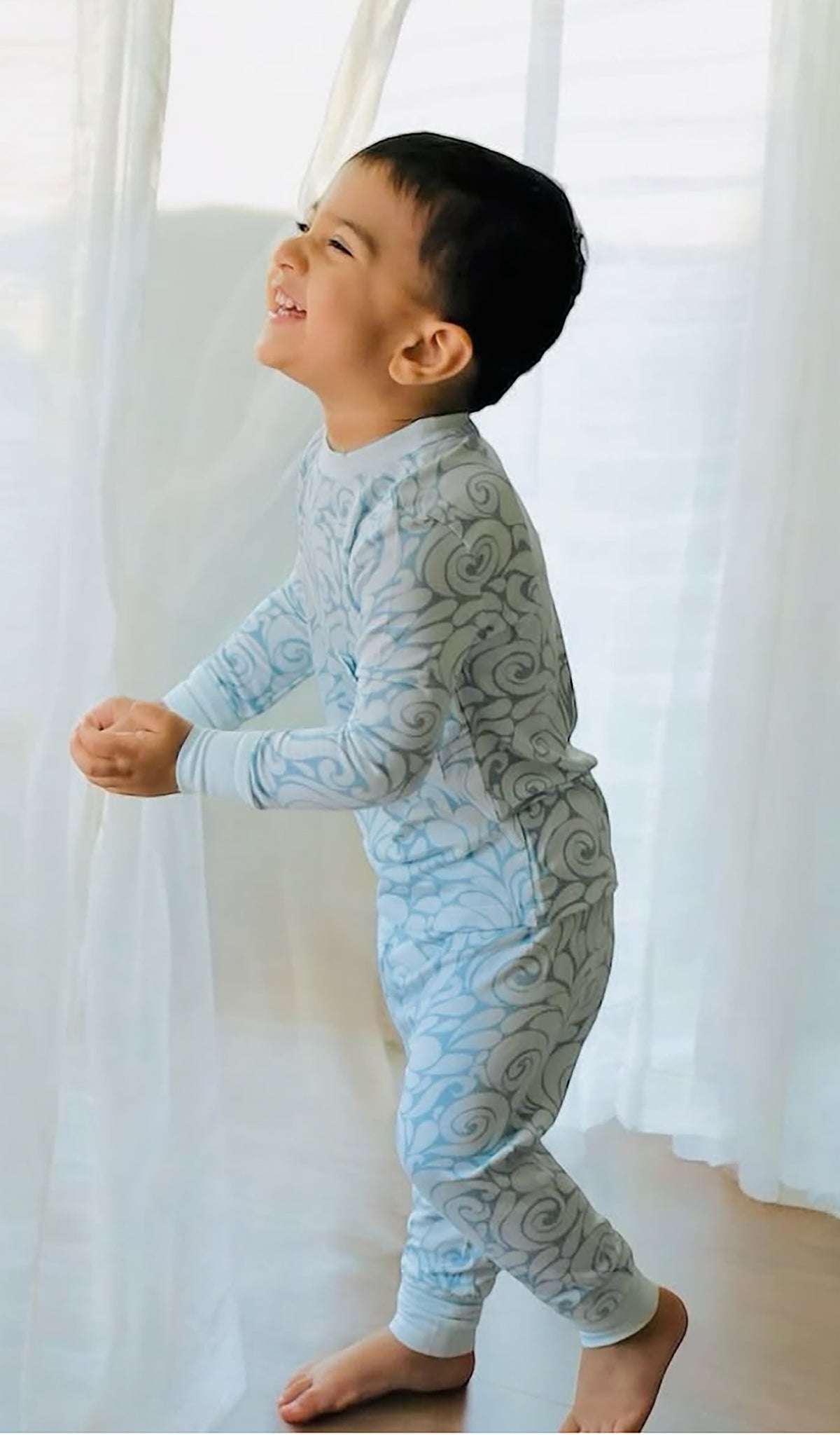 Waves Emerson 2-Piece Pant PJ worn  by little boy smiling.