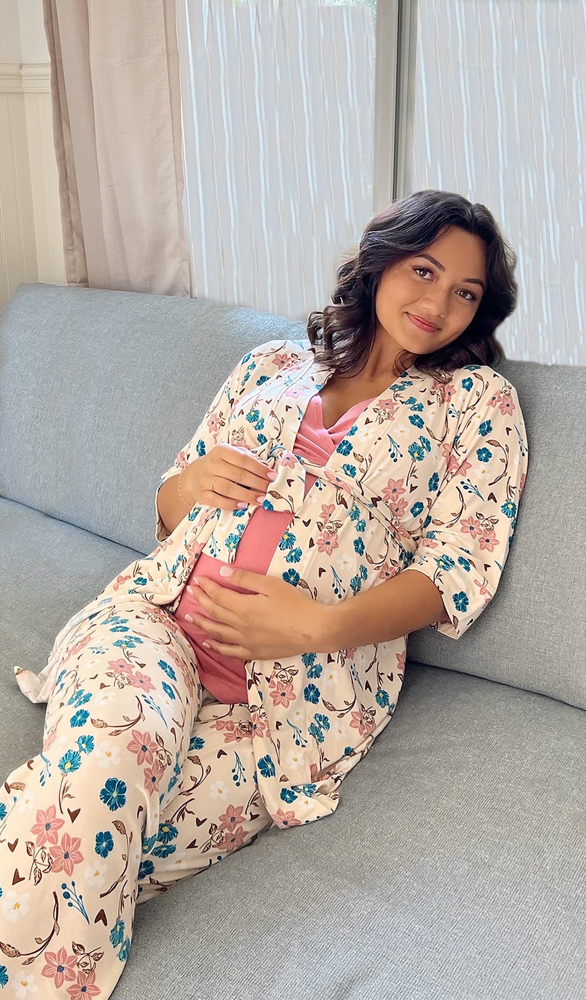 Magnolia Analise 5-Piece Set worn by pregnant woman sitting on sofa with hands resting on belly.
