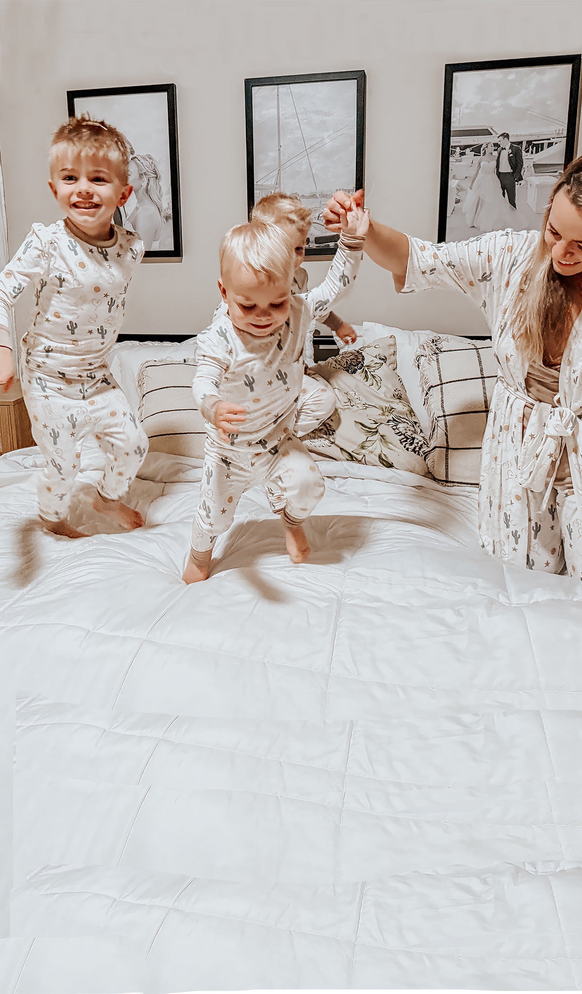 Rodeo Emerson Kids 2-Piece Pant PJ worn by 3 little boys jumping on the bed with their mom.