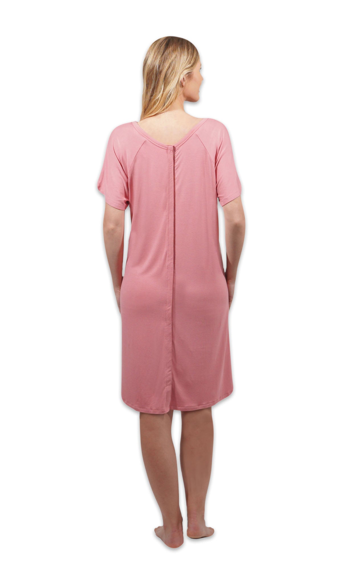 Rose Rosa hospital gown. Back shot of woman wearing hospital gown with full-length snap-back opening.
