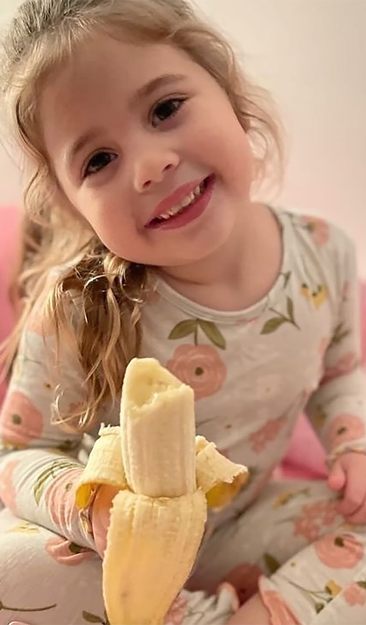 Carnation Charlie Kids 3-Piece Pant PJ worn by little girl eating a banana. Headwrap not shown.