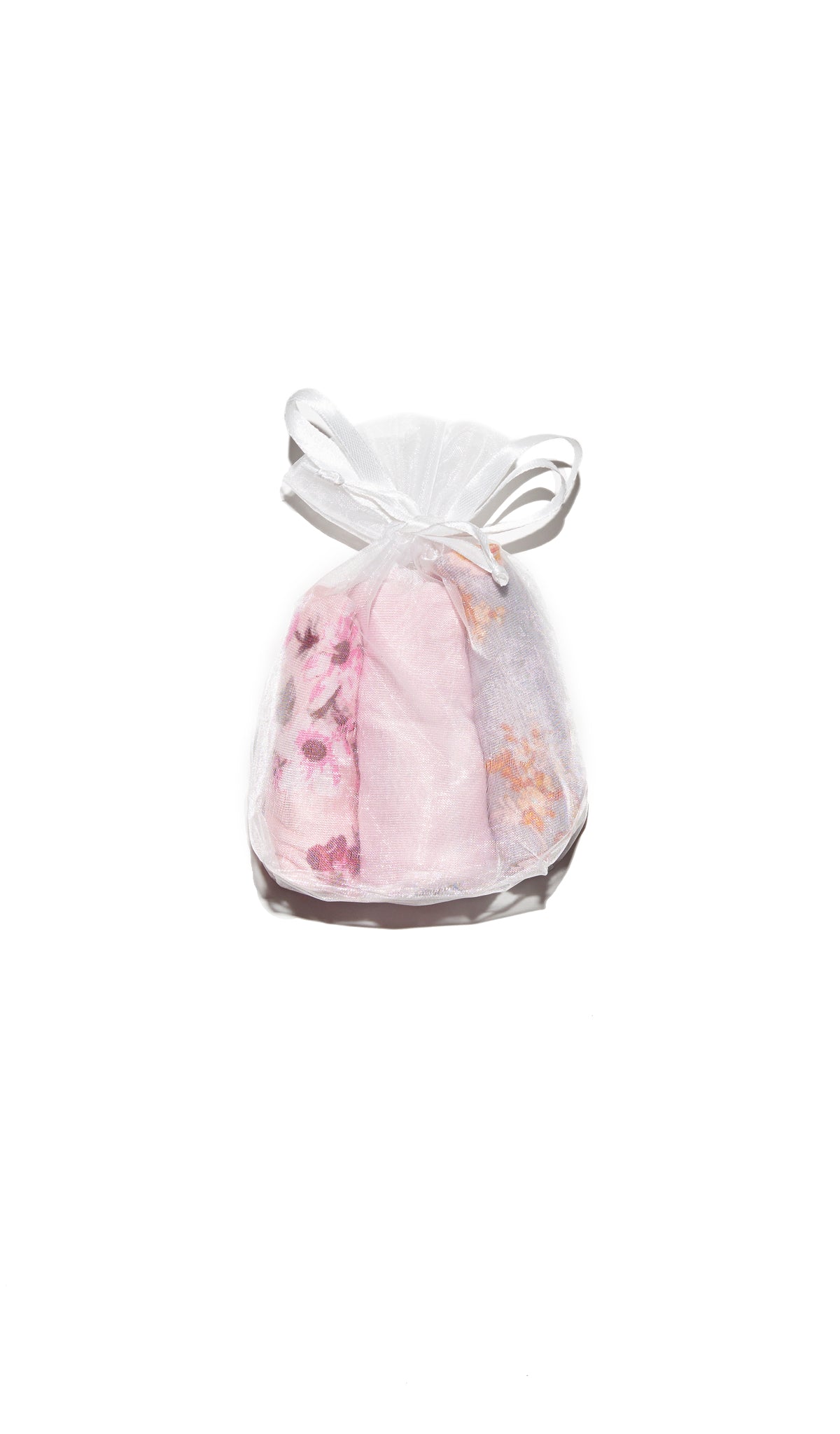 Blossom Kayla Kids 3-Pack Underwear product shot showing blossom print, solid blush pink, and boho print underwear rolled up and packaged in organza drawstring gift bag.