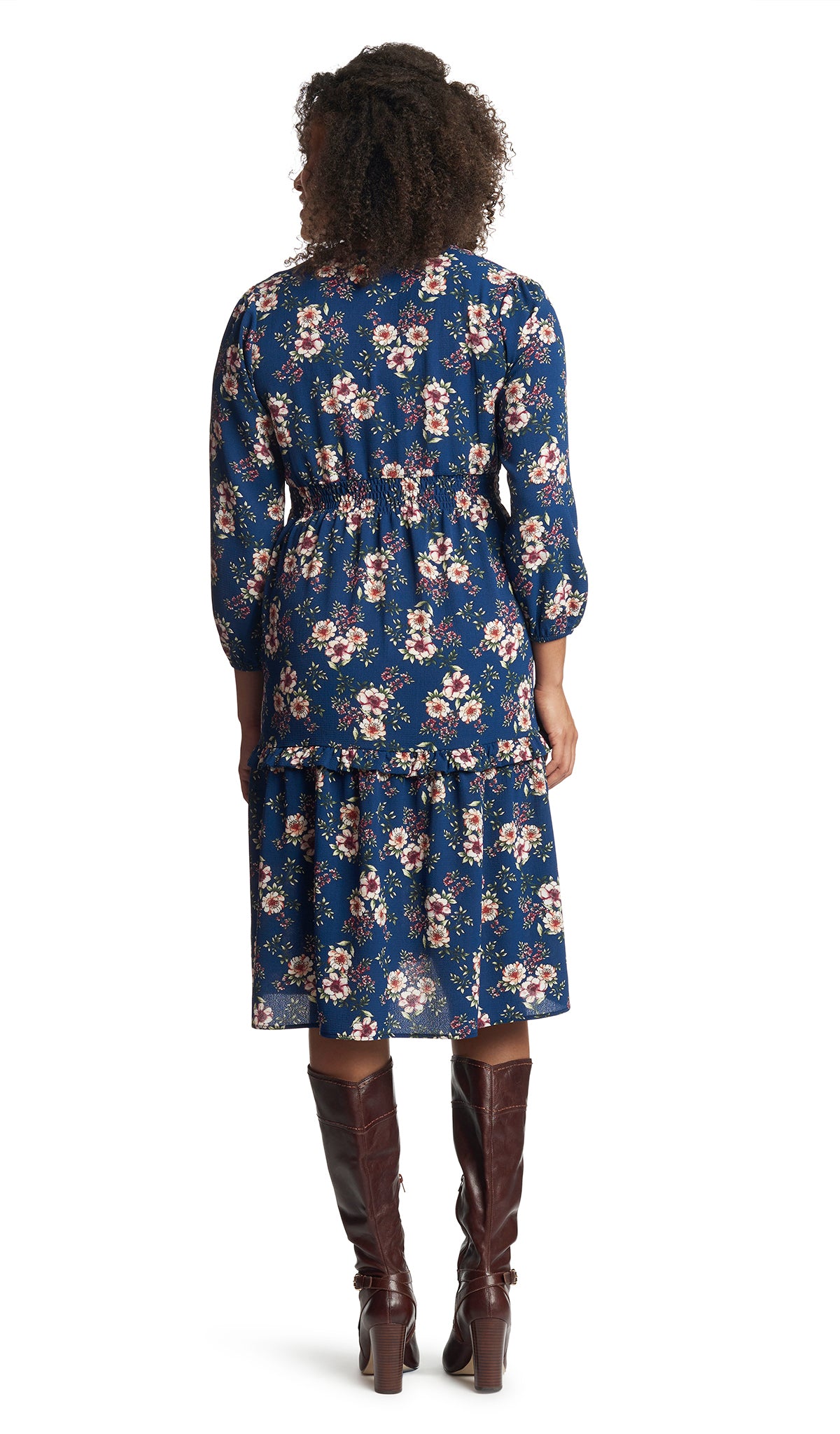 Blue Floral Jenny Dress. Back shot of woman wearing Jenny Dress with burgundy boots.