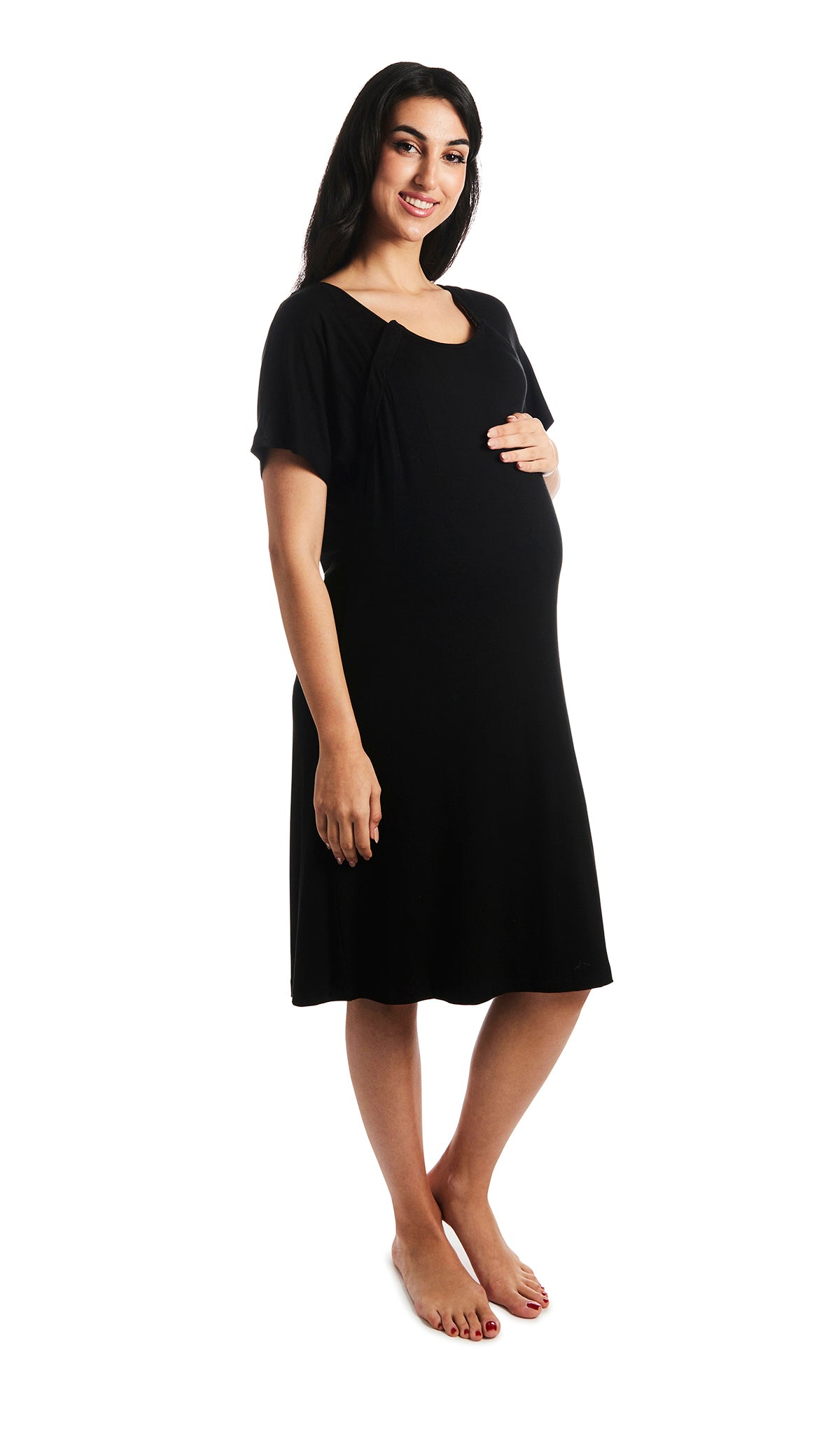 Black Rosa hospital gown. Pregnant woman with one hand on belly, wearing hospital gown with scoop-neckline featuring dual snap openings.