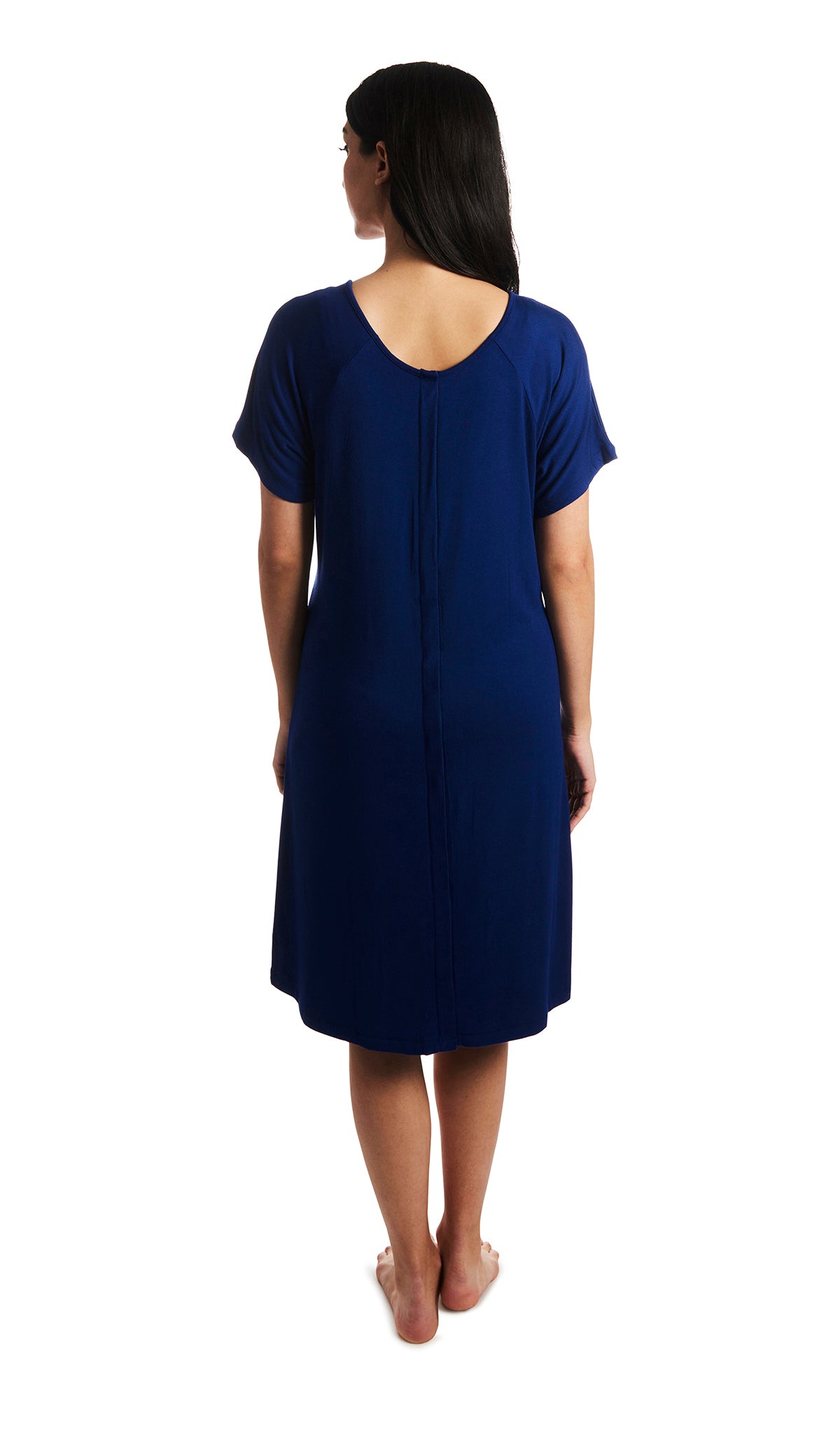 Denim Blue Rosa hospital gown. Back shot of woman wearing hospital gown with full-length snap-back opening.