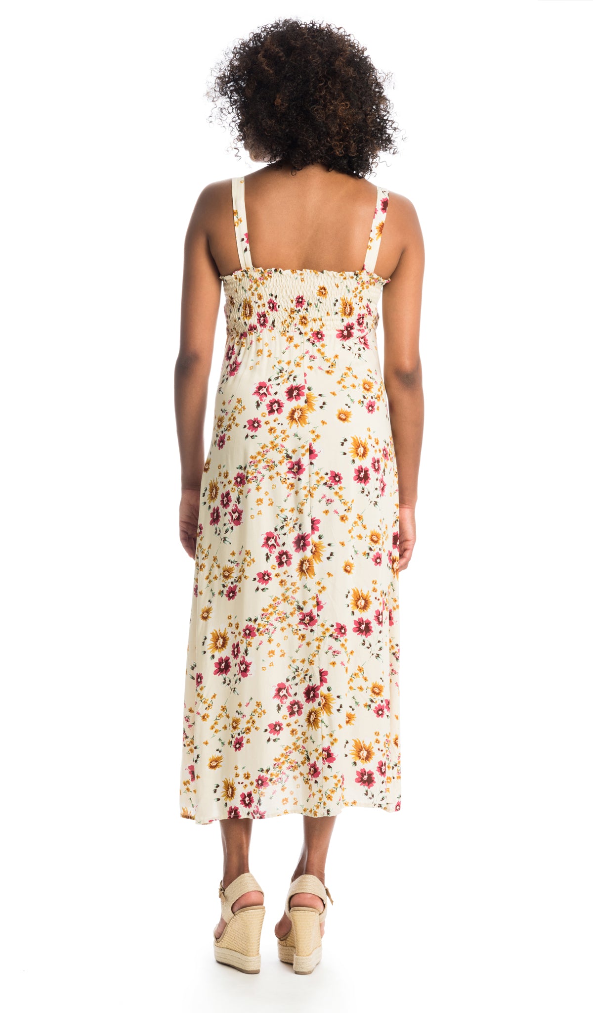Vintage Floral Savannah back shot of woman wearing dress with elastic back smocking detail.