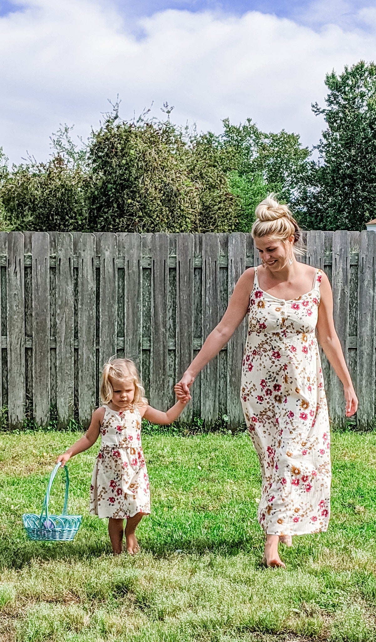 Vintage Floral Savannah dress worn by woman who is holding little girl's hand who is wearing matching Catalina Kids Dress and holding an Easter basket.