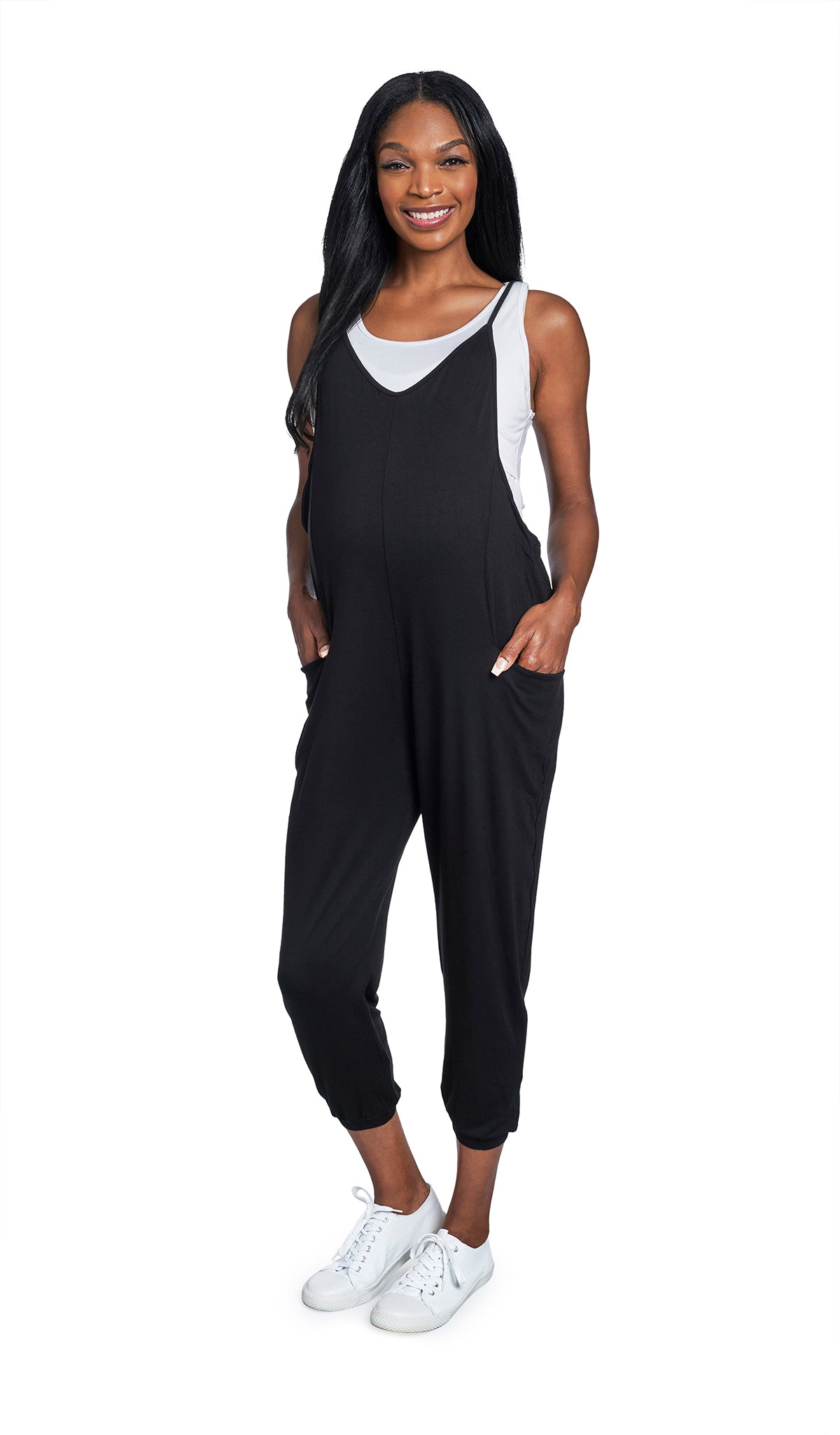 Black Brandi Romper. Pregnant woman wearing Brandi romper over white Kara tank and with tennis shoes.
