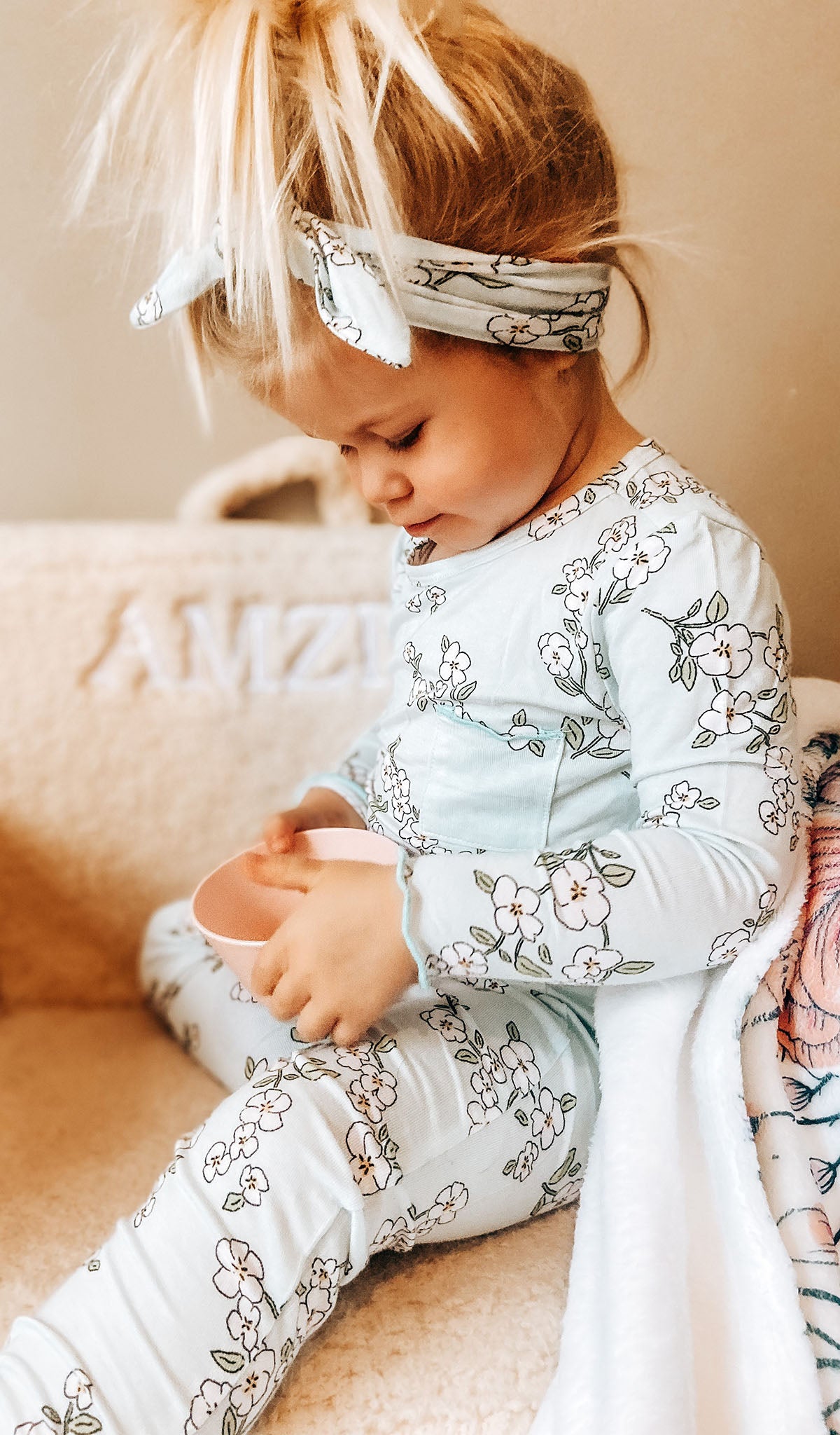 Baby's Breath Charlie Baby 3-Piece Pant PJ worn by little girl holding a pink bowl.