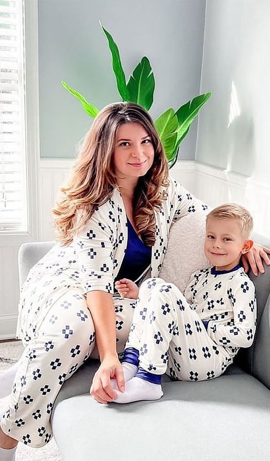 Geo Emerson Kids 2-Piece Pant PJ worn by little boy sitting on couch next to his mom.