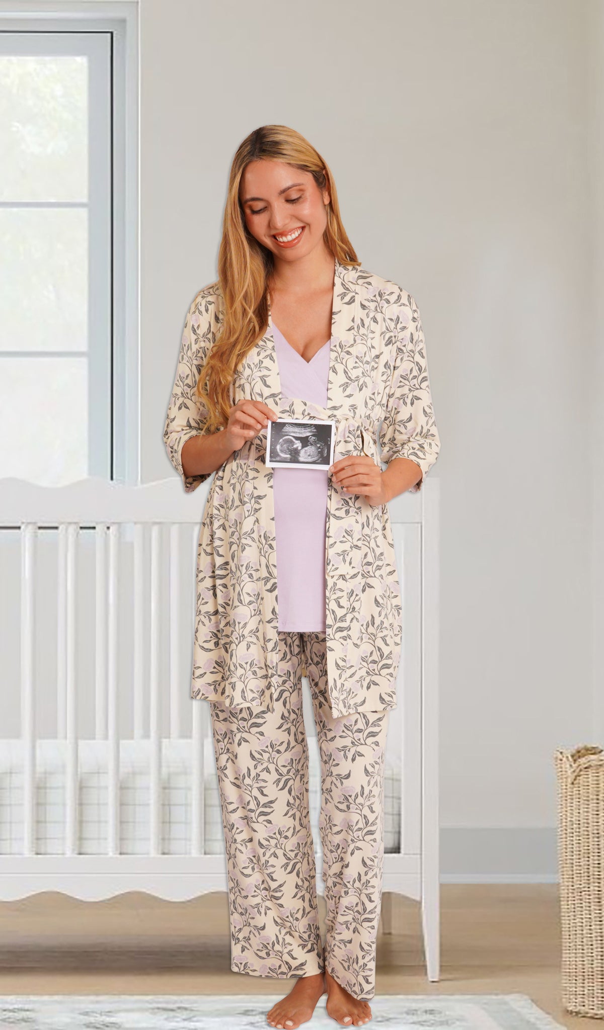 Poppy Analise 5-Piece Set, woman wearing robe, tank top and pant standing in front of a crib holding an ultra sound picture.