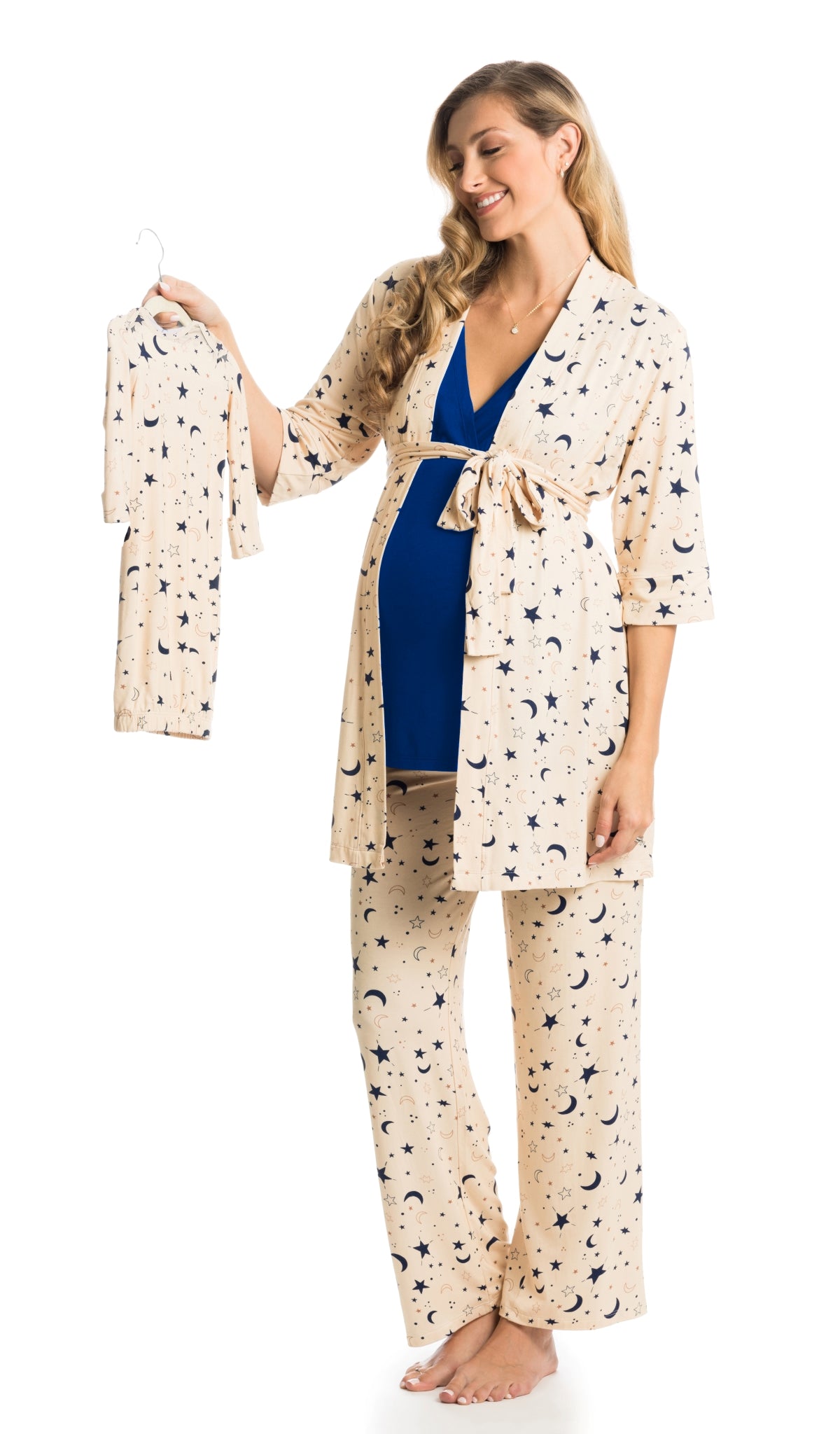 Twinkle Analise 5-Piece Set. Pregnant woman wearing 3/4 sleeve robe, tank top and pant while holding a baby gown.