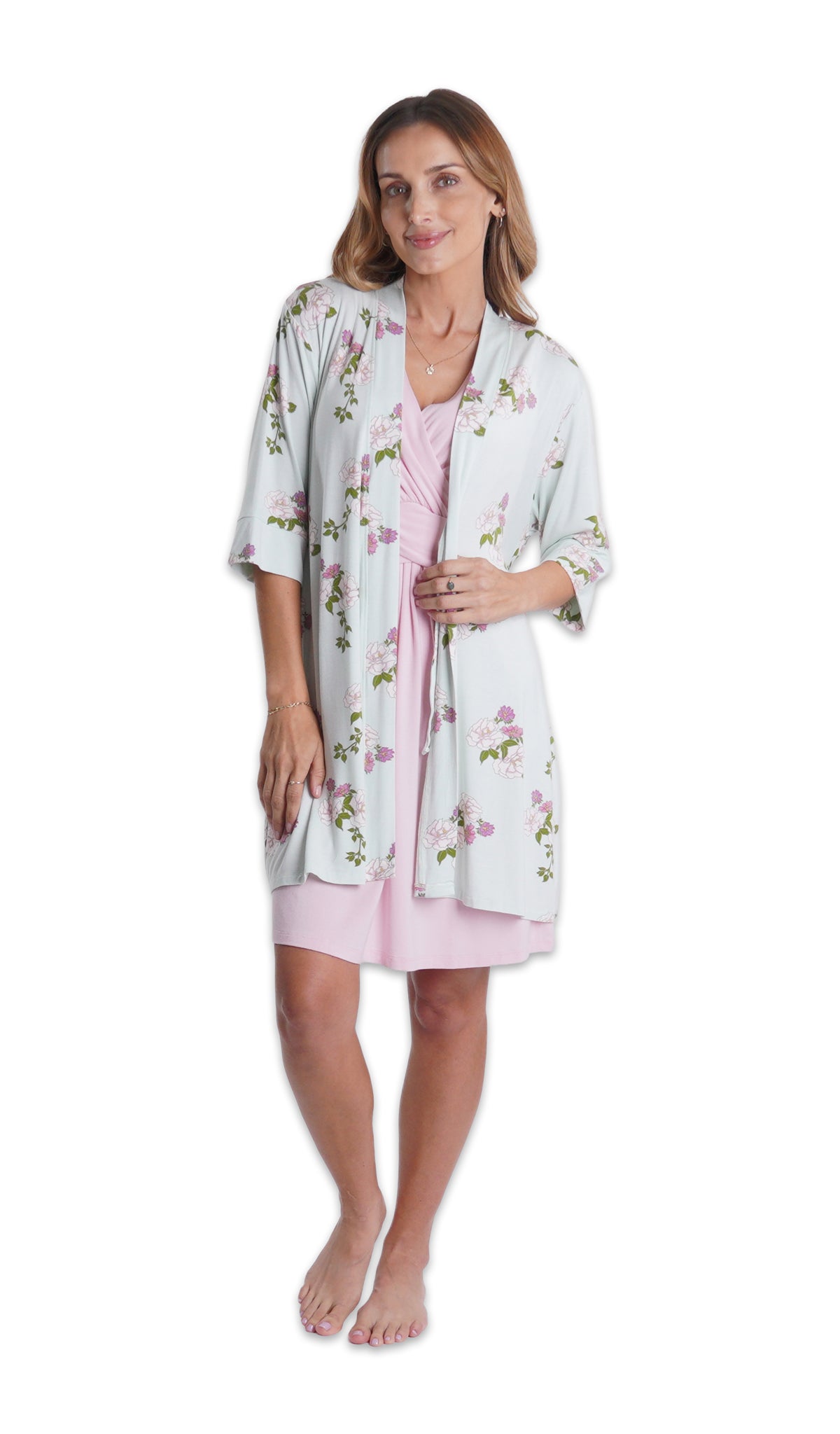Blush Evie Nightgown. Woman wearing Peony floral printed robe over Evie nightgown one hand gripping the robe opening.