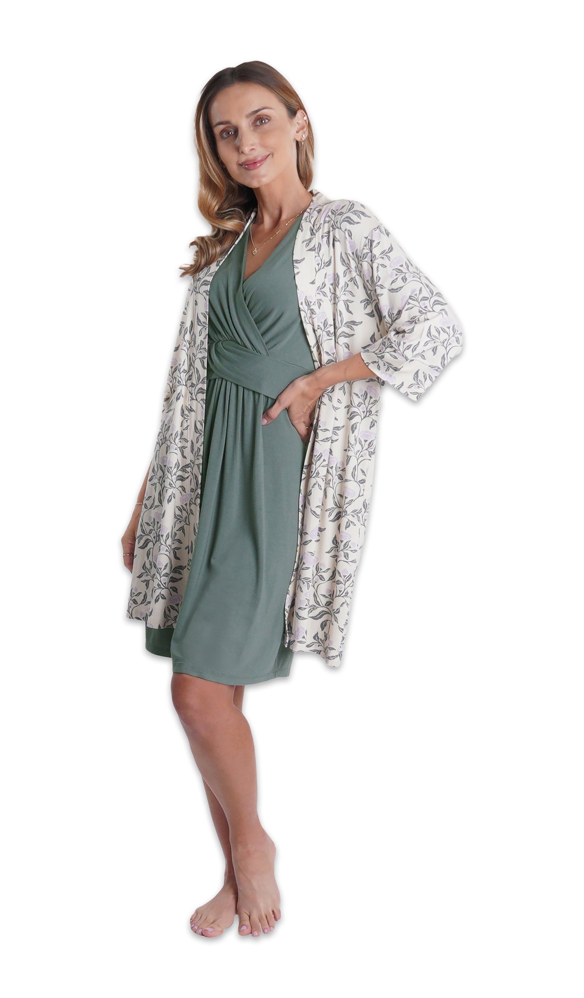 Fog Evie Nightgown. Woman wearing Eucalyptus printed robe over Evie nightgown with one hand on hip.