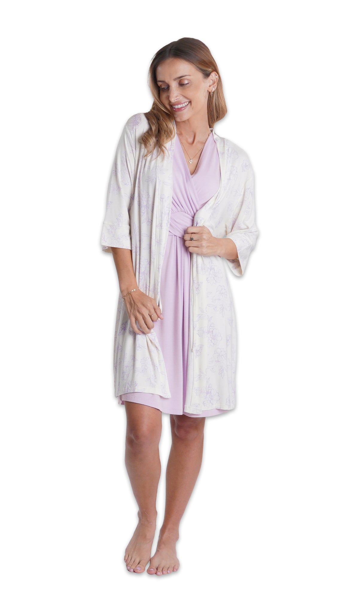 Lavender Evie Nightgown. Woman wearing Bali floral printed robe over Evie nightgown with hands gripping the robe opening.