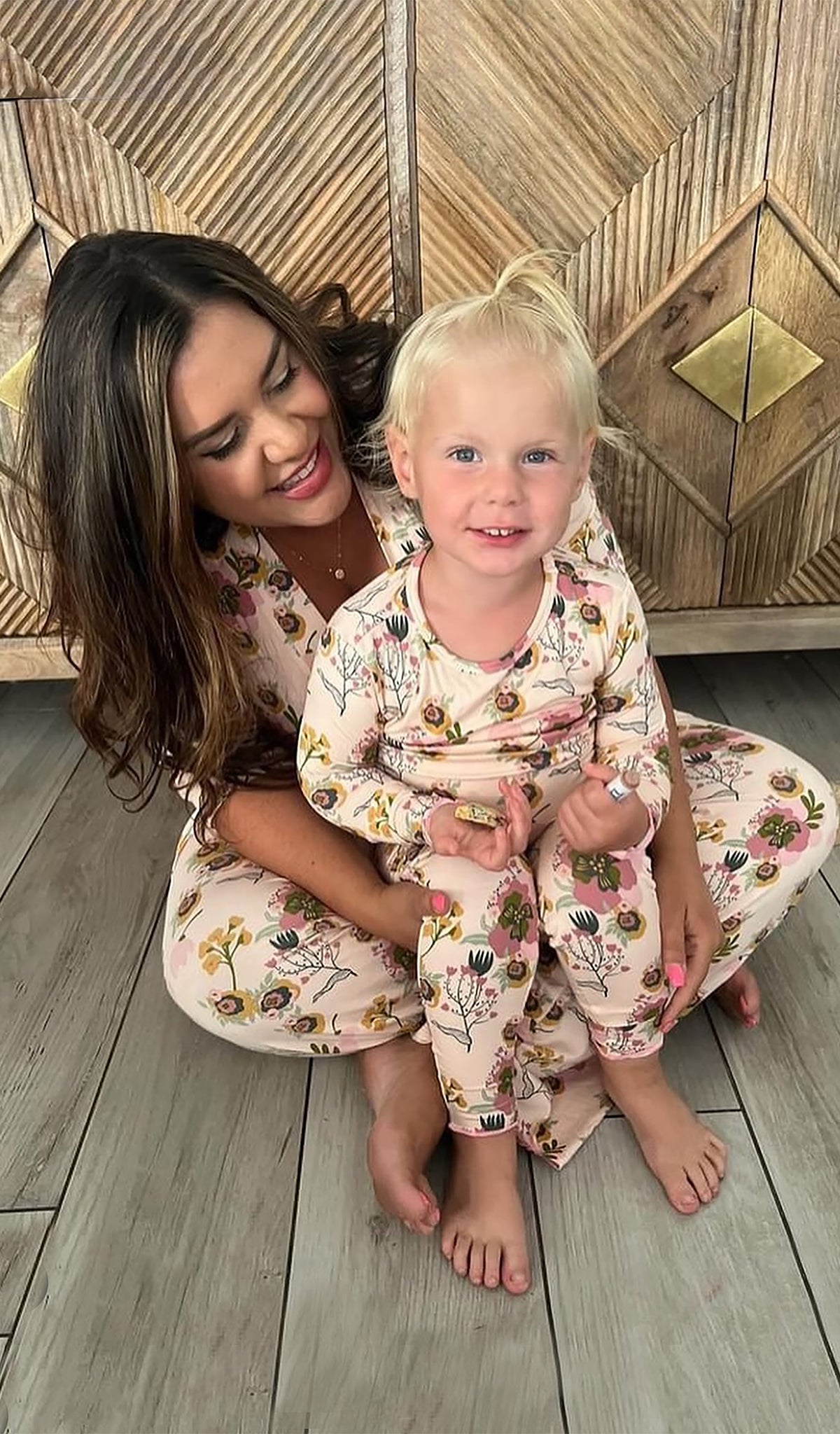 Camellia Charlie Baby 3-Piece Pant PJ worn by little girl sitting on her mom's lap.  Headwrap is not shown in picture.