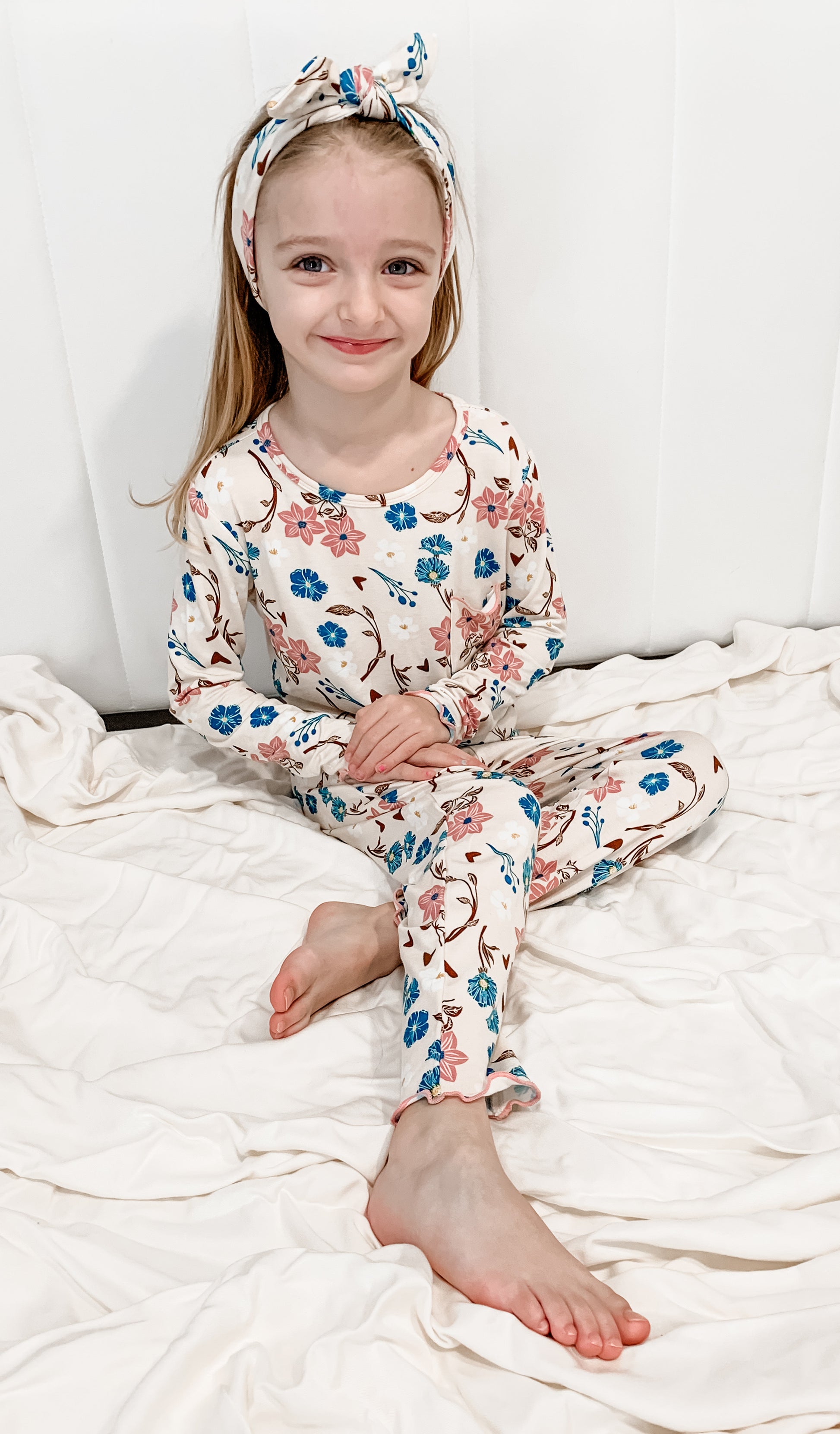 Magnolia Charlie Kids 3-Piece Pant PJ worn by little girl sitting on her bed.