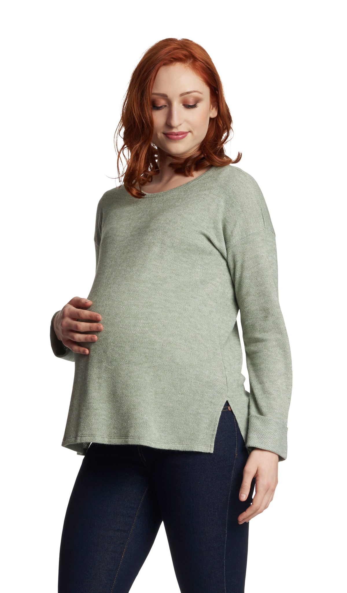 Moss Andria sweater worn by pregnant woman with one hand on her belly.