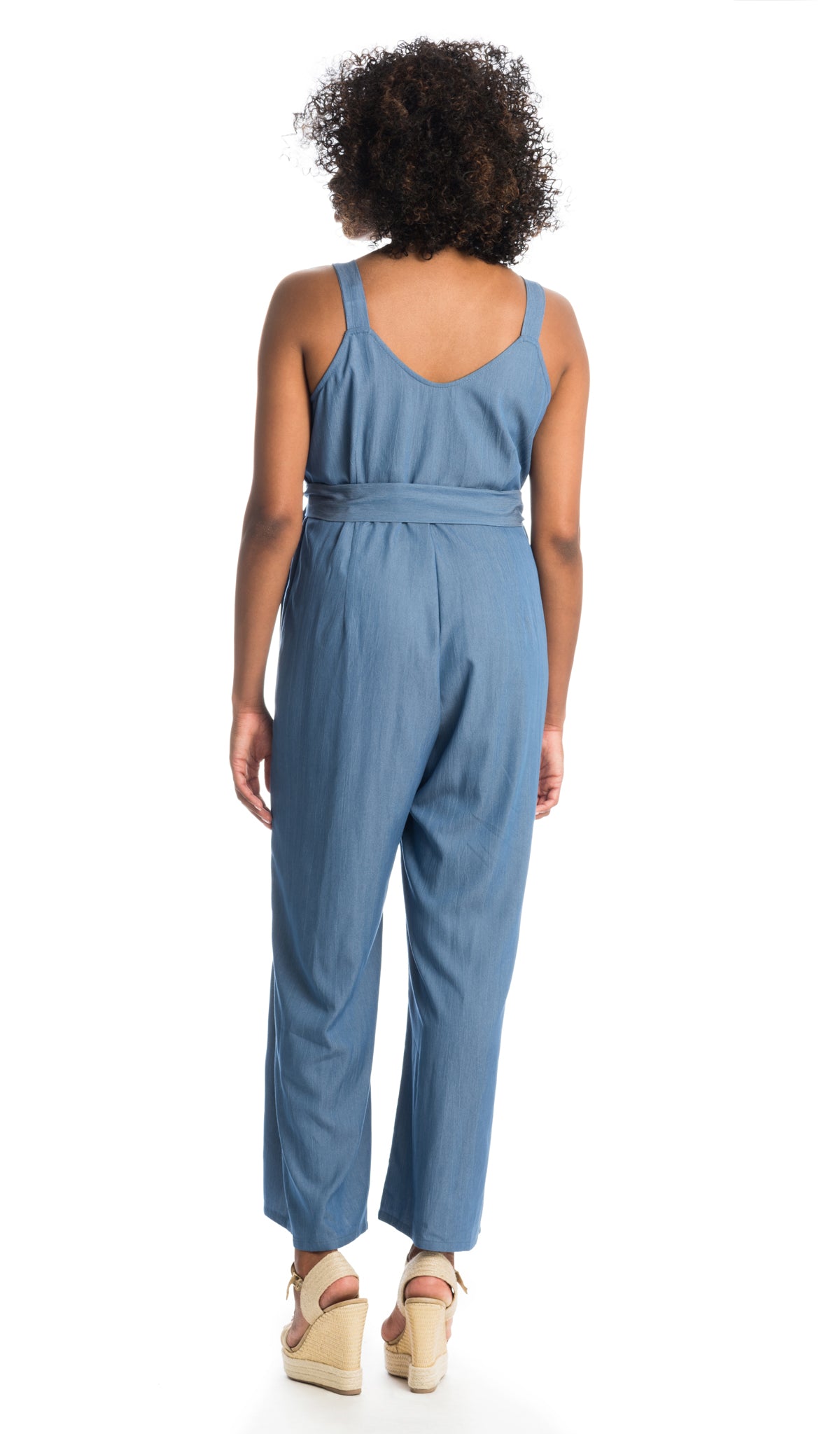 Blue Luciana romper back shot of woman wearing with wedge heels.