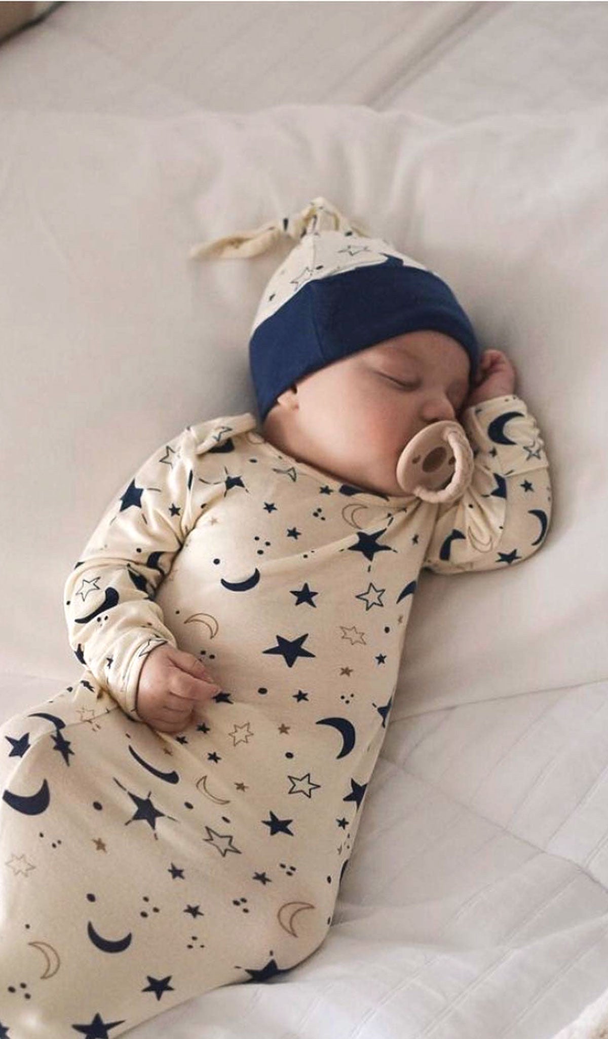 Twinkle Gown 2-Piece worn by sleeping baby.